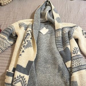 Cream colored belted cardigan, size large.